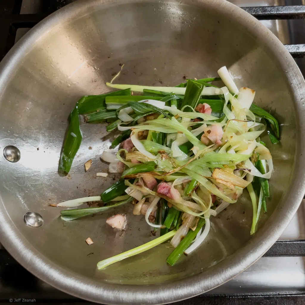 Sauté pan with ramps bacon and onions